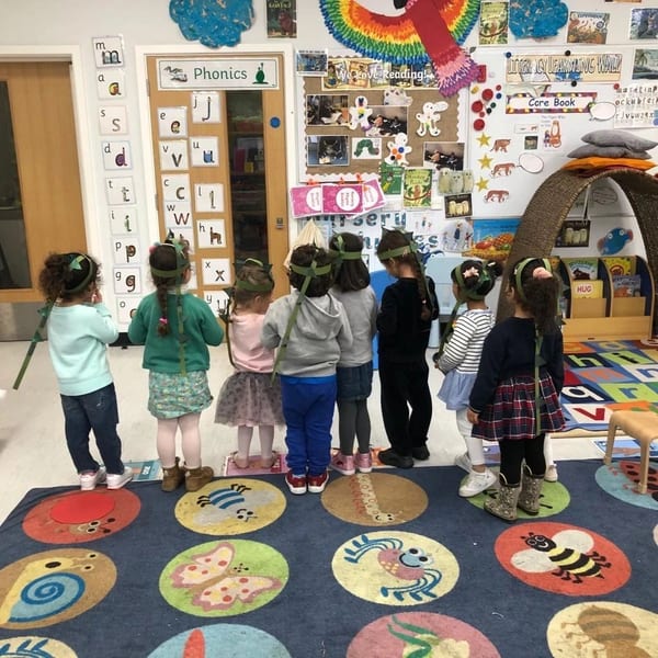Children creating flower craft projects together