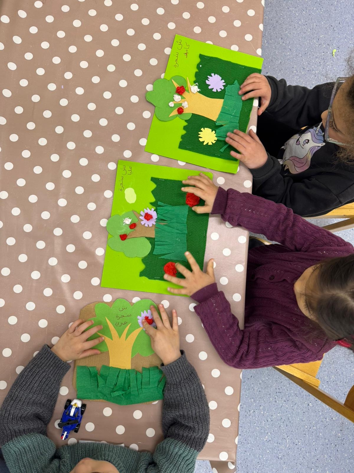 Children creating flower craft projects together